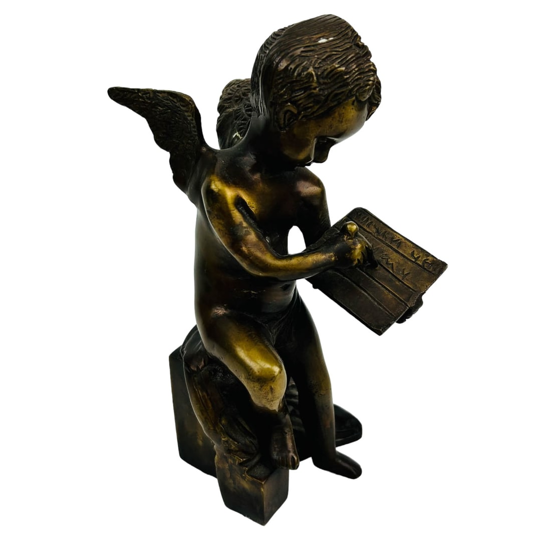 Bronze Nude Winged Cherub Writing Letter Sculpture: 20th century bronze metal figural shelf mantle curio cabinet display article. Depicts the mythological heavenly winged putty seated on a base, penning a love letter. No apparent markings. Dimensions: