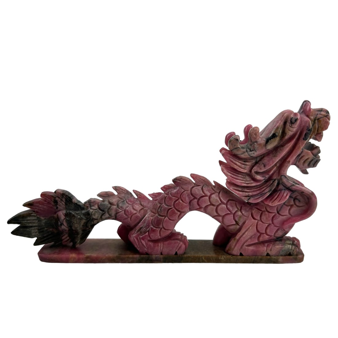 Chinese Carved Rhodochrosite 6" Dragon Sculpture: 20th century hand carved hardstone gemstone sculptural desk paperweight / figurine. Depicts the mythological and ferocious legendary dragon creature open mouth baring it's fangs and fish scale design 