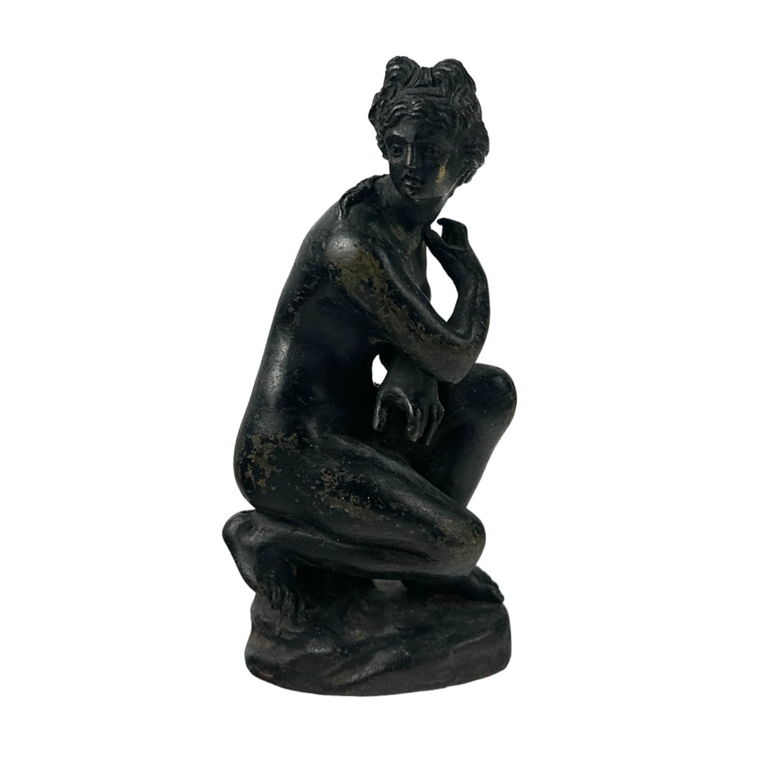 Bronze Aphrodite Crouching Venus 4" Nude Sculpture: A 20th century grand tour style bronze Roman female nude miniature sculpture. Features Aphrodite as referred to as The Crouching Venus in kneeling pose with one arm bent in front of her body, the othe