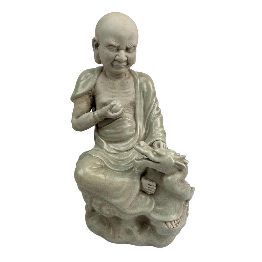 Chinese Buddha w/ Dragon White Porcelain Sculpture: Nice example of hand crafted porcelain artistry of Chinese cultural art. Subject matter features the revered deity God, Buddha / Kwan Yin in seated meditation pose, holding the pearl of wisdom in one 