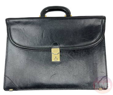 Bruno Magli Italian Black Leather Briefcase Case: Luxury men's accessory with gold tone hardware, solid sturdy carry handle with fold over flap and a flat compartment. Beige colored leather interior with a flat zippered compartment and small pocket