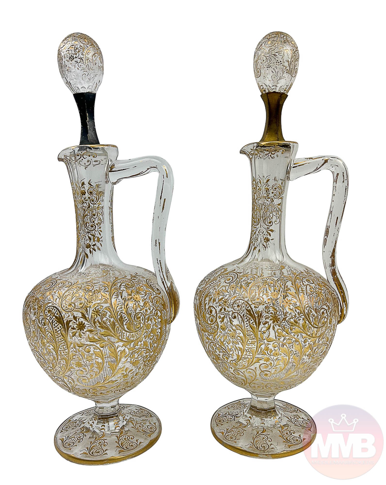 Moser Czech Gold Etched Crystal Wine Decanter 2pc: Bohemian Czech 20th Century bar barware liquor alcohol spirit bar barware decanter two (2) piece lot. Each features an engraved gold gilt floral decoration to the rounded body, the elongated neck with