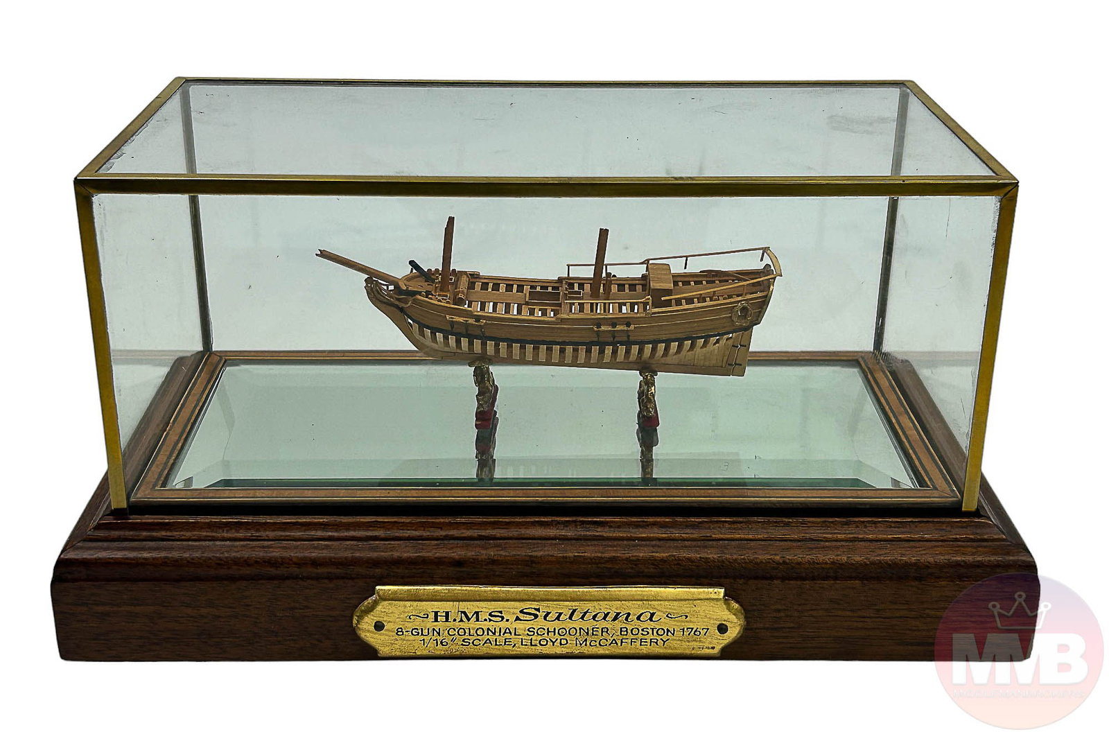 HMS Sultana Colonial Schooner Wood Ship Model Case: Model of the H.M.S. Sultana, a small Royal Navy eight (8) gun Colonial Schooner. Modeled by Lloyd McCaffery on a 1/16" scale. Mounted atop a beveled mirrored base and housed in a gilt brass frame, und