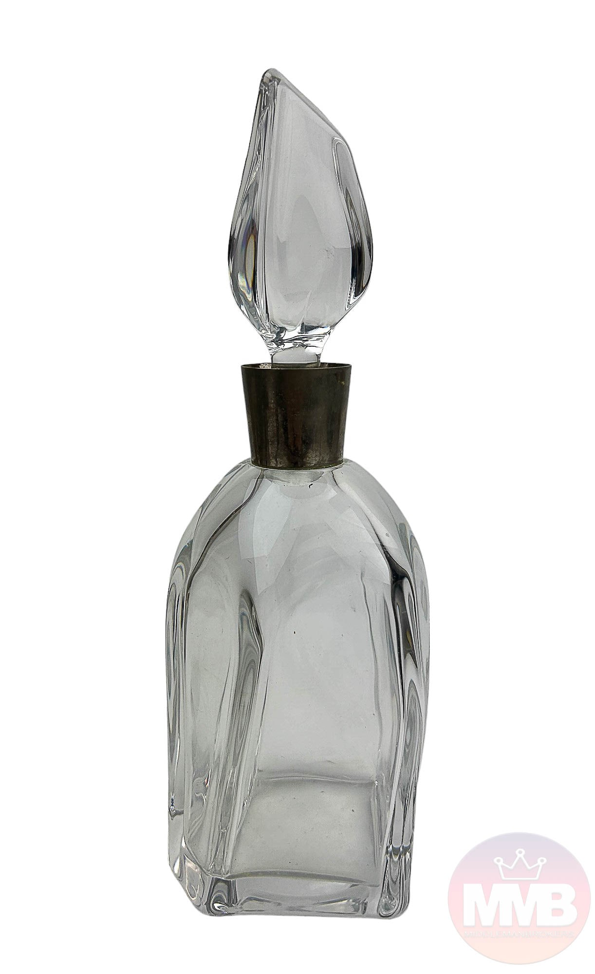 Daum Crystal Art Deco Bar Barware Liquor Decanter: French 20th Century clear crystal art glass wine, alcohol, spirit decanter. Designed with an asymmetrically shaped body with a metal neck collar. Flame style shaped glass stopper with frosted dauber.
