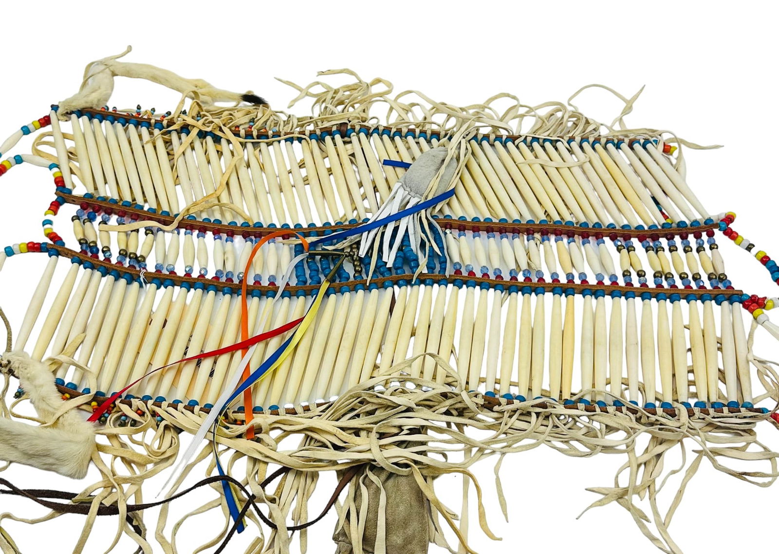 Native American Indian Bead Hairpipe Breastplate: An authentic / genuine article of Native American Indian cultural art. handcrafted in manner and making use of long bone hair pipes, colorful spacer beads, bells, fur, having partial leather construct