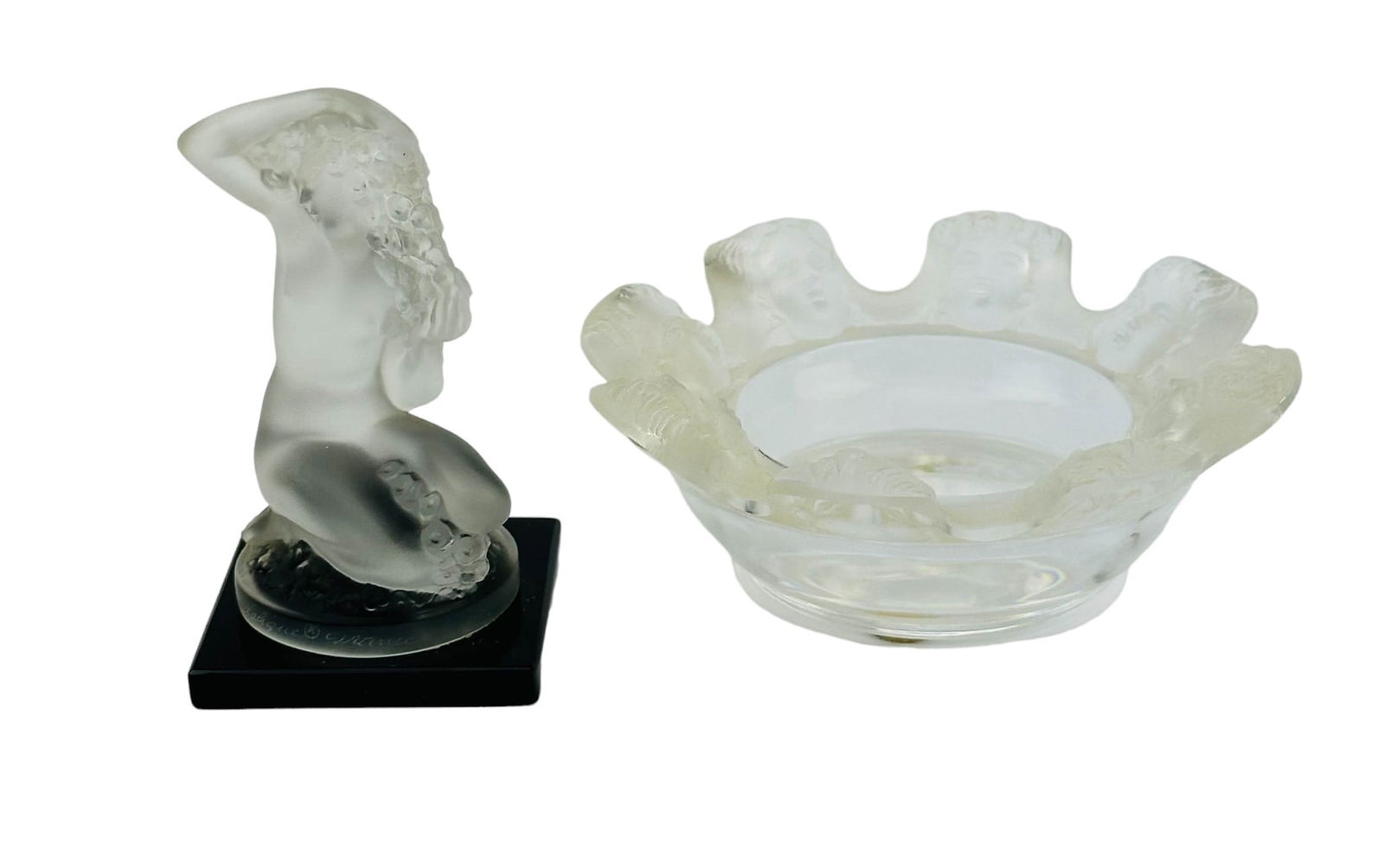 Lalique Floreal Sculpture St Nicholas Ashtray Bowl: Estate lot of two (2) 20th century French clear and frosted crystal art glass sculpture and a coffee table cigarette ashtray bowl. Includes one (1) "Floreal" ~ a kneeling nude on a square black glass
