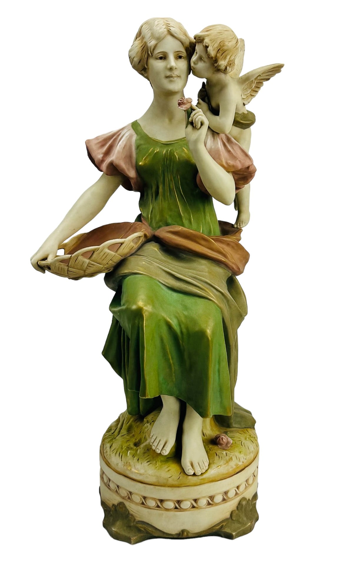 Royal Dux Art Nouveau Maiden w/ Angel 23" Figurine: Early 20th century hand painted porcelain figural sculpture. Depicts a seated slender maiden, holding a pierced woven basket on her lap, the mythological heavenly nude winged cherub putti, perched on 