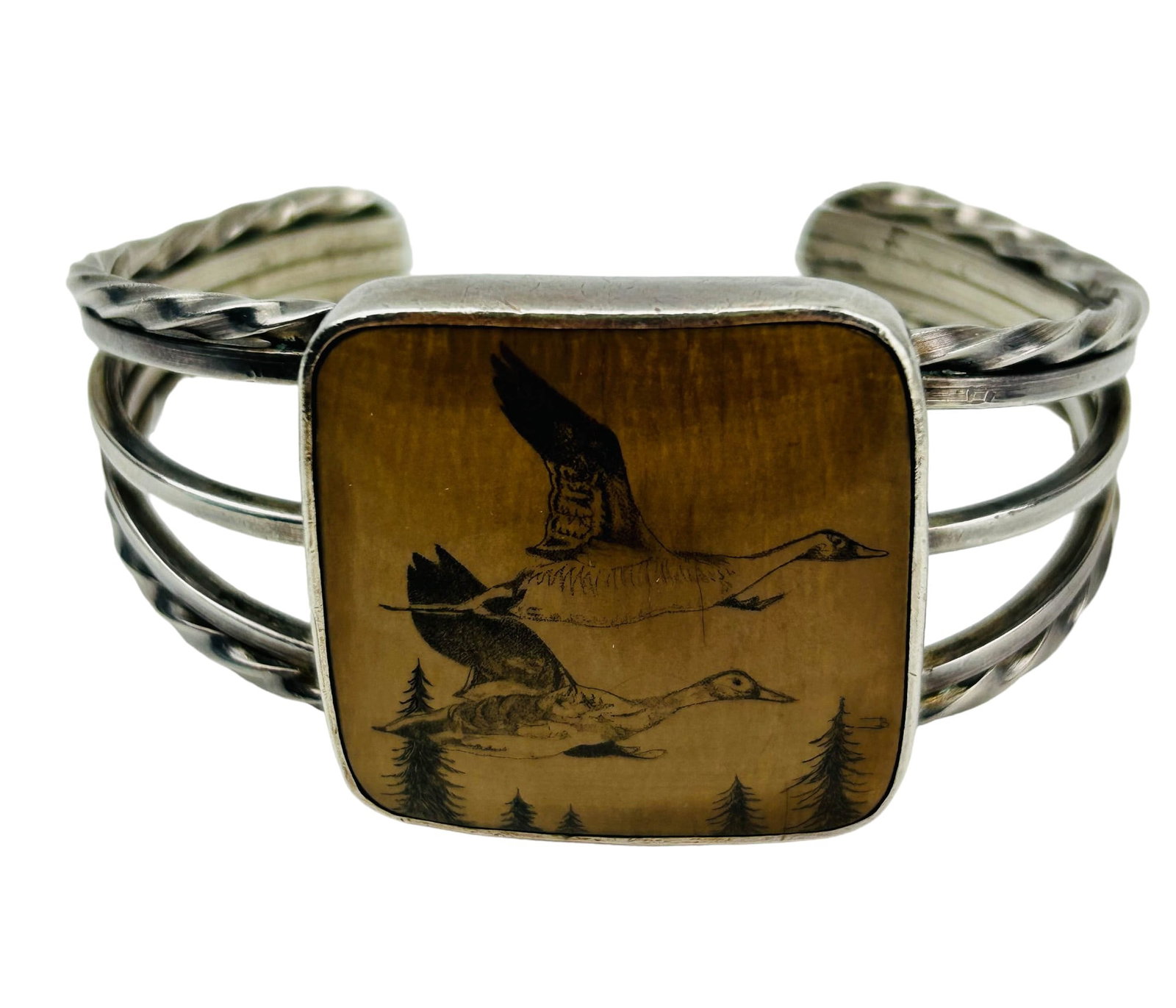 Inuit Indian Etched Scrimshaw Sterling Bracelet: handcrafted Inuit style sterling silver 925 and scrimshaw cuff bangle bracelet. An etched Canadian goose in flight design featured on the square shaped scrimshaw material. Shoulders on opposite sides 