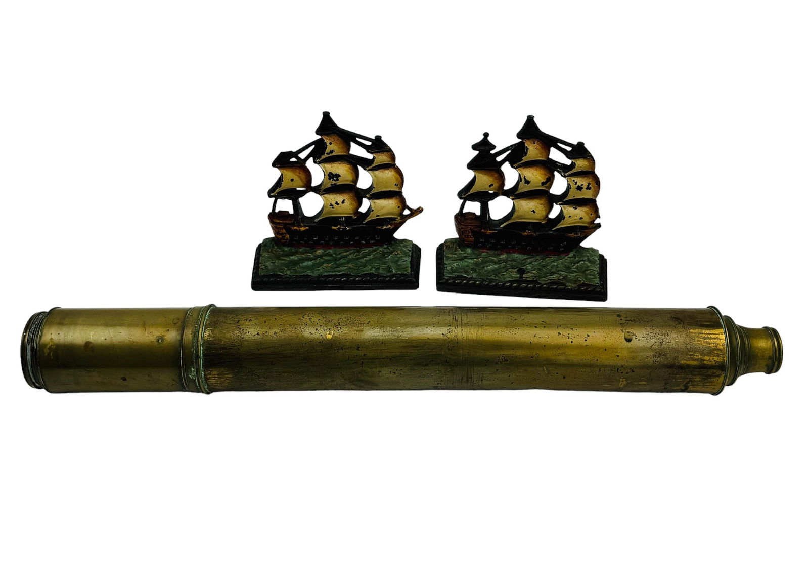 Melling Liverpool Telescope Galleon Ship Bookends: Estate lot of a total of two (2) home interior decorative objects. Includes ~ One (1) Pair of painted cast iron HMS Victory galleon ship bookends. One (1) Melling Liverpool telescope. Bookends measure