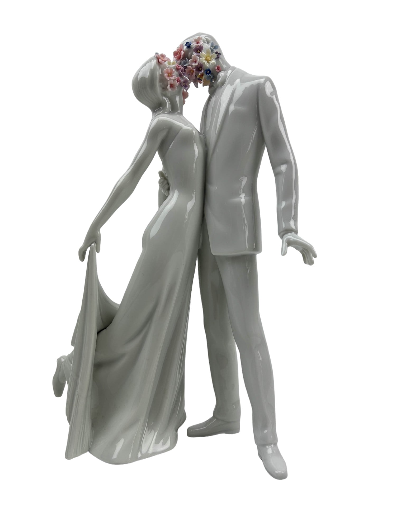 Lladro Love Blossoms Porcelain Couple Figurine: Manufacturer / Brand : Lladro. Country of origin : Spain. Name : Love I (Blossoms). Sculptor / Designer : Virginia Gonzalez. Introduced : 2008. Finish : Glazed. Subject matter depicts a couple kissing