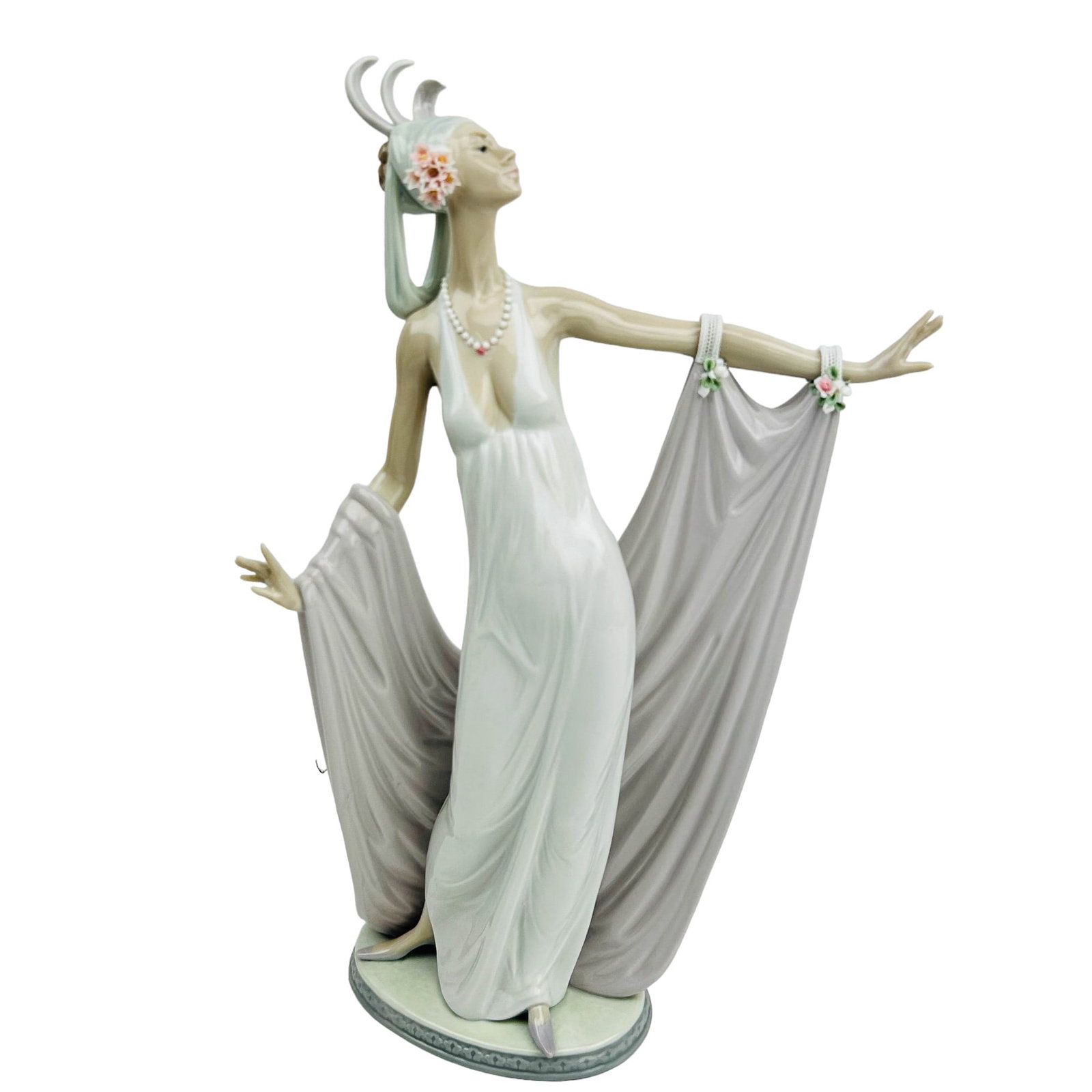 Lladro Spain Grand Dame # 1568 Porcelain Figurine: Manufacturer : Lladro, Country of origin : Spain. Name : Grand Dame. Model number : 1568. Production years : 1987 - 2000. Designer : Jose Puche. Finish : Glazed. Subject matter features young slender 