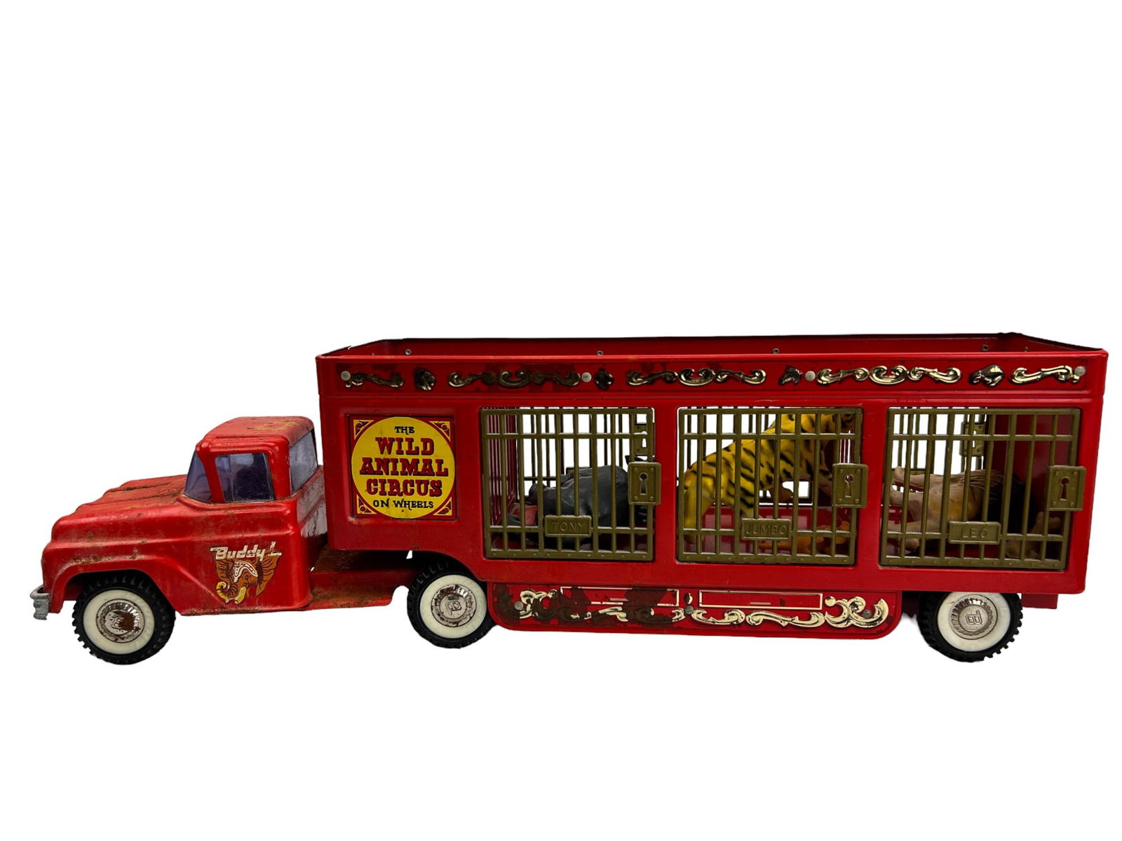 Buddy L The Wild Animal Circus on Wheels Toy Truck: Pressed steel Circus Truck and Trailer by Buddy L. Wildly popular traveling zoo toy truck from the 1960's, that would bring circus animals to town. Accompanied with a plastic lion and cub, tiger and c