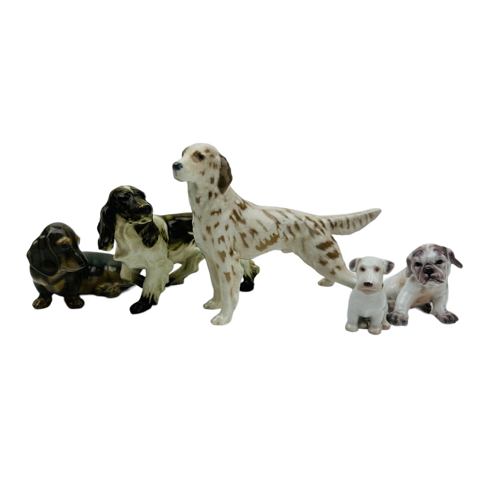 Royal Copenhagen Danish Porcelain Dogs ESTATE LOT: Estate collection of 20th century Denmark hand painted porcelain curio cabinet display dog figurines. The K9 animal dog breeds include ~ One (1) Royal Copenhagen Dachshund #3140. One (1) Bing Grondahl