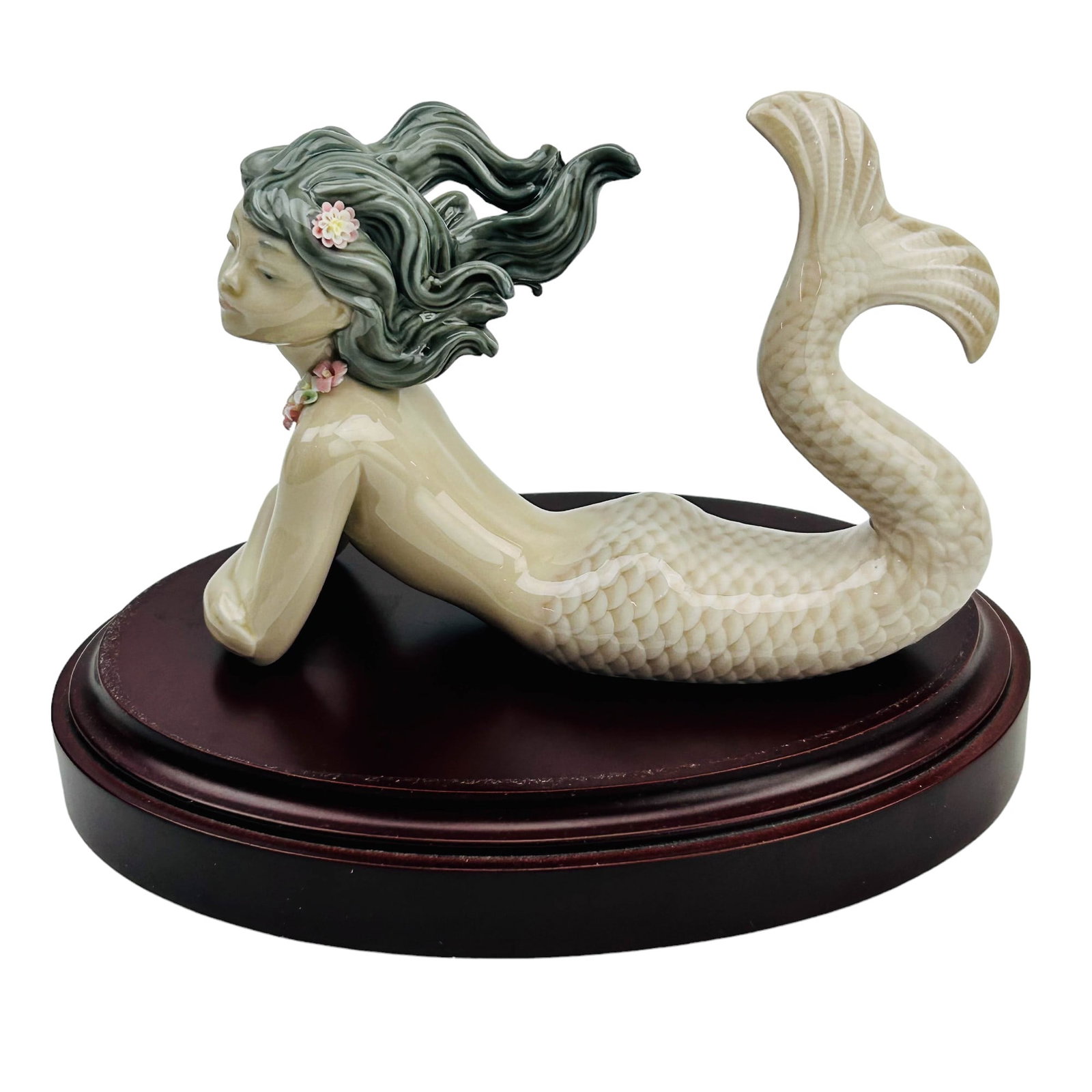 Lladro Fantasy # 1414 Mermaid Porcelain Figurine: Manufacturer : Lladro, Country of origin : Spain. Name : Fantasy. Model number : 1414. Production years : 1982 - 2017. Designer : Jose Puche. Finish : Glazed. Subject matter features this fantasy land