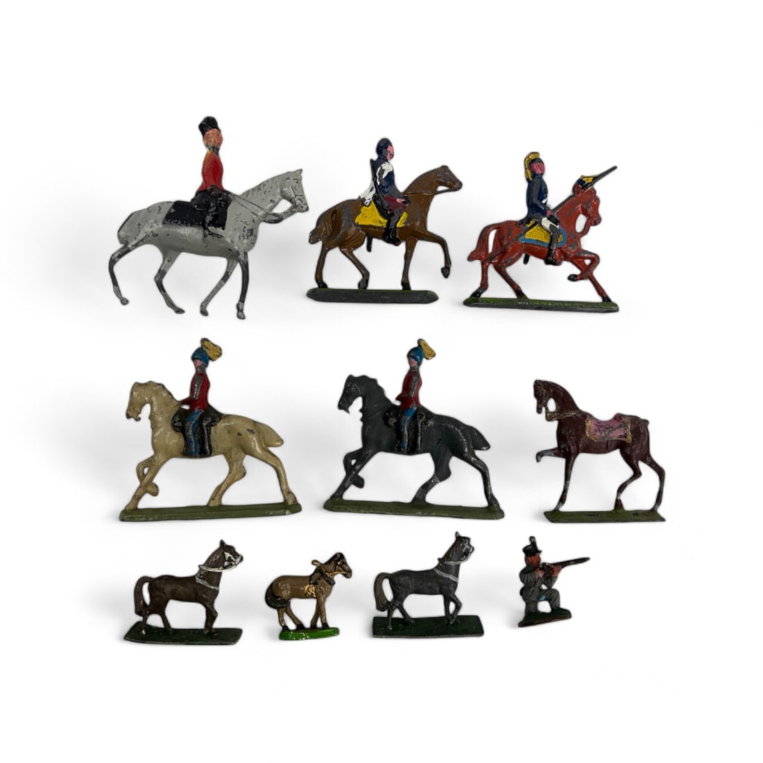 Miniature Horse & Horse w/ Rider Toy Lead Figurine: An estate collection that features a diverse assembly of miniature lead toy horses and mounted horses. Some depict various military and infantry units on horseback. The remainder features horses in di