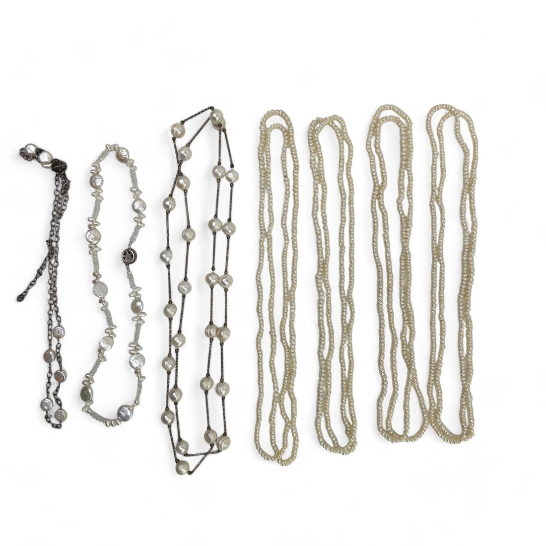 Freshwater Pearl Necklace Choker Estate Lot 7p LOT: Features a collection of elegant freshwater pearl necklaces, showcasing a variety of designs. Included are a baroque pearl necklace connected by silver-plated links, offering a striking contrast betwe
