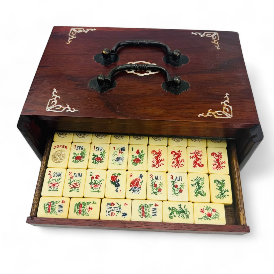 Chinese Bone and Bamboo Mahjong Set in Inlaid Box: A Chinese Mahjong set, featuring hand-painted polychrome bone and bamboo tiles. a total of 165, complete with dice and chips. Included are 10 jokers. The set is housed in an elegant custom wooden box