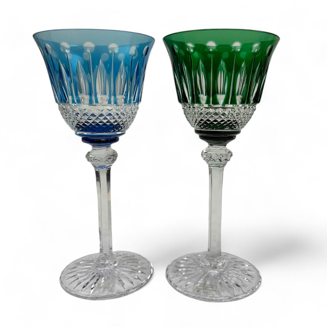 St Louis Tommy Blue & Green Barware Wine Goblet PR: Late 20th century pair of French crystal art glass bar barware wine hocks. Modeled by Saint Louis, France in their "Tummy" pattern. Circa 1987. One bowl with a sky blue coloration, the other with an e