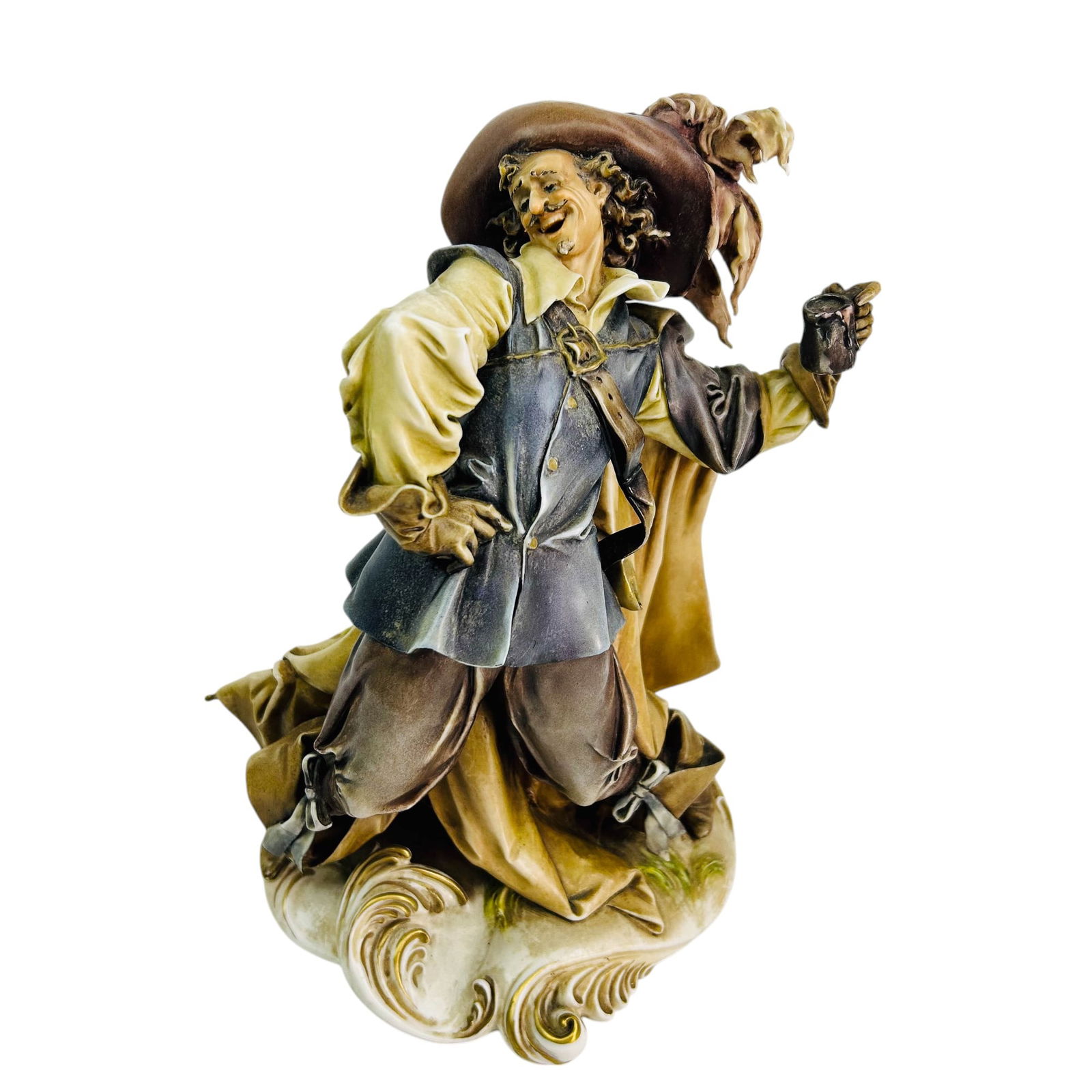 Borsato Capodimonte Musketeer w Stein Mug Figurine: Antonio Borsato (Italian, 1911 - 1982 ) hand painted porcelain figurine. Depicts a jovial and lively musketeer in a dynamic pose, dressed in traditional attire, including a wide brimmed feathered hat,