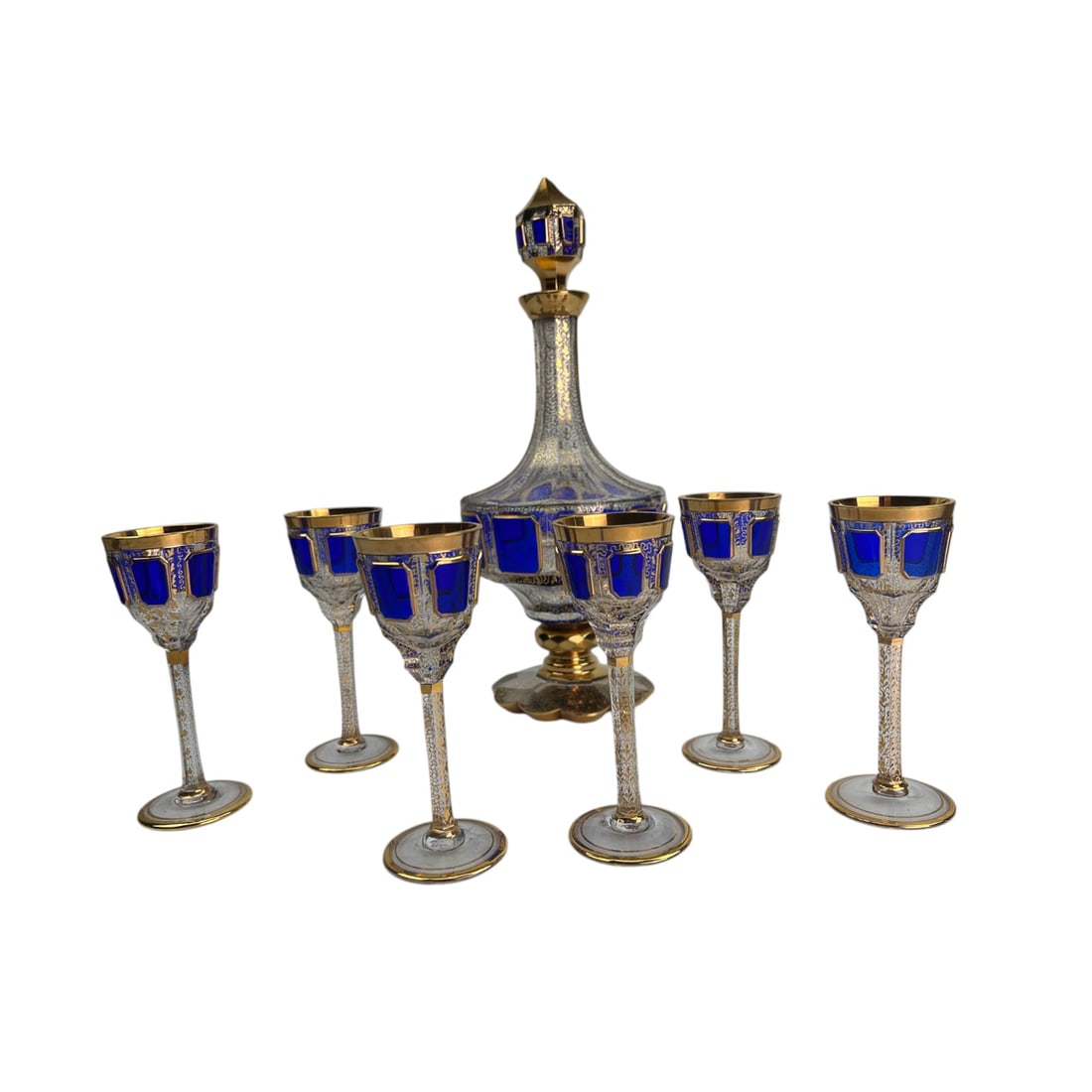 Moser Cobalt Blue Gold Gilt Decanter w/6 Cordials: Moser crystal bar barware liquor, alcohol, wine decanter featuring a striking cobalt blue panel design, accented with intricate gold gilt detailing and engraved floral motifs with matching stopper. Th