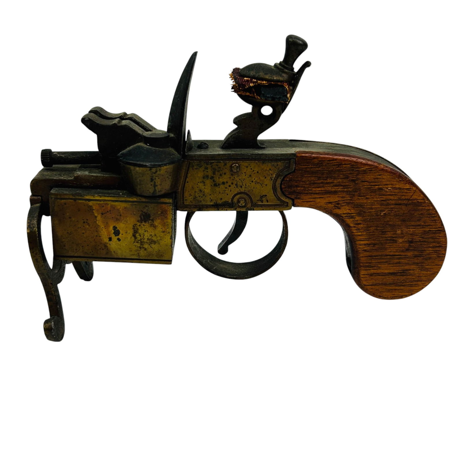 Dunhill Tinder Flintlock Pistol Cigarette Lighter: Early 20th century Dunhill Tinder Pistol crafted in the USA. featuring a flintlock inspired design. This collectible piece mimics the form of an antique flintlock pistol, complete with a brass and ste