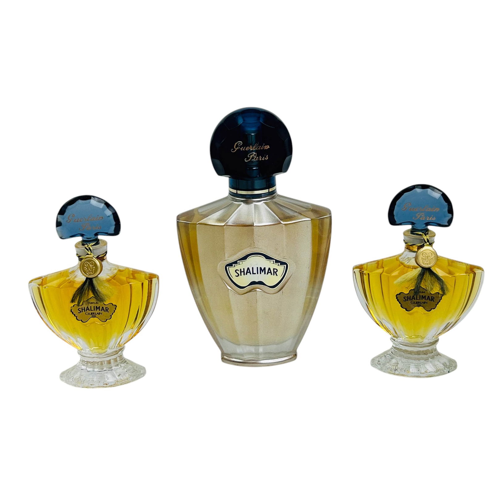 Shalimar Guerlain Paris Parfum Scent Bottle 3pc: Three piece lot of Shalimar by Guerlain Paris perfume bottles, featuring both classic and modern designs. Lot Includes (2) Vintage Parfum Bottles (15ml/.5 fl oz each). Featuring the iconic ribbed glas