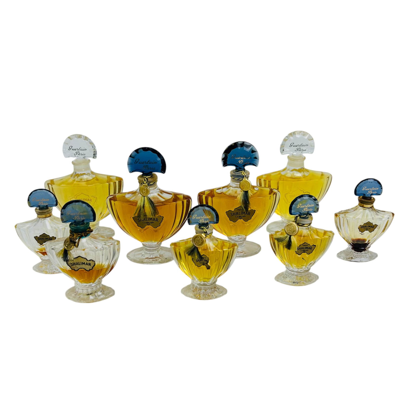 Shalimar Guerlain Paris Scent Perfume Bottle 9pc: Nine piece lot of Shalimar by Guerlain Paris perfume bottles. This collection includes a mix of vintage and modern designs. Lot Includes ~ Multiple vintage fan-stopper bottles featuring the signature