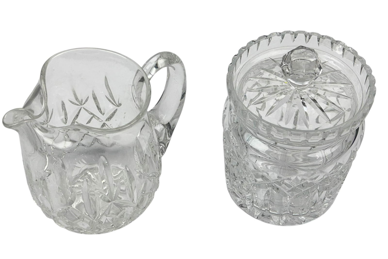 Waterford Crystal Lismore Pitcher Jug & Cookie Jar: Estate lot of a total of two Waterford Irish clear crystal art glass kitchenware serve ware. Includes ~ One (1) Juice Iced Tea Beverage pitcher jug with ice lip. One (1) Lidded cookie barrel jar. Both