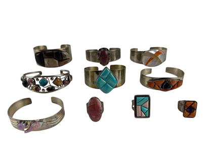 DTR 10 pc. Lot Sterling Rings Bracelets 313 Grams: DTR ten (10) piece lot including seven cuff bracelets with stones and three rings with stones. Stones include turquoise, onyx, quartz, and various other minerals. Bracelet dimensions range from 0.75"