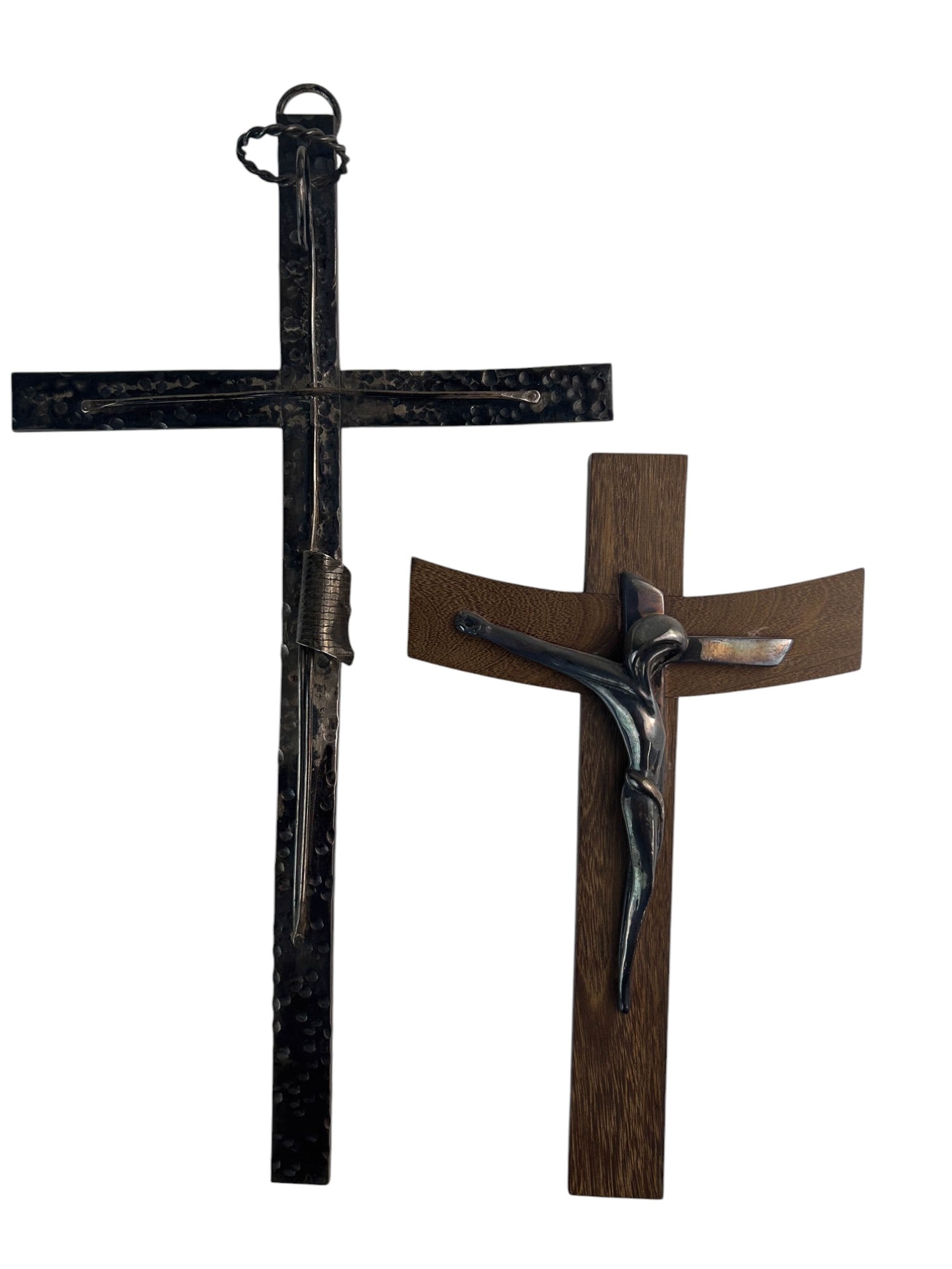 Sterling Jesus Christ on Cross Crucifix Sculptures: Lot of two sterling silver 925 Catholic religion themed crucifix. One is artisan hand crafted having minimalist design on a hand hammered cross. The other is sterling silver 925 over wax mounted on a 