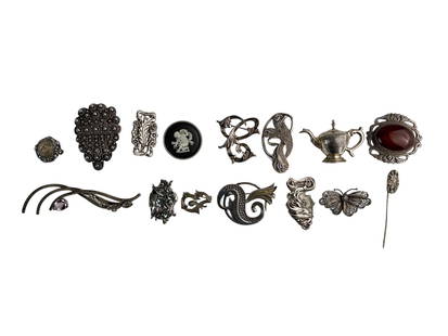 Sterling Silver 925 Brooch Pins ESTATE LOT 15pc: Estate collection lot of a total of fifteen pieces of sterling silver 925 brooch pins. Features a variety of designs including floral, figural, abstract, and cameo styles. Includes detailed filigree w