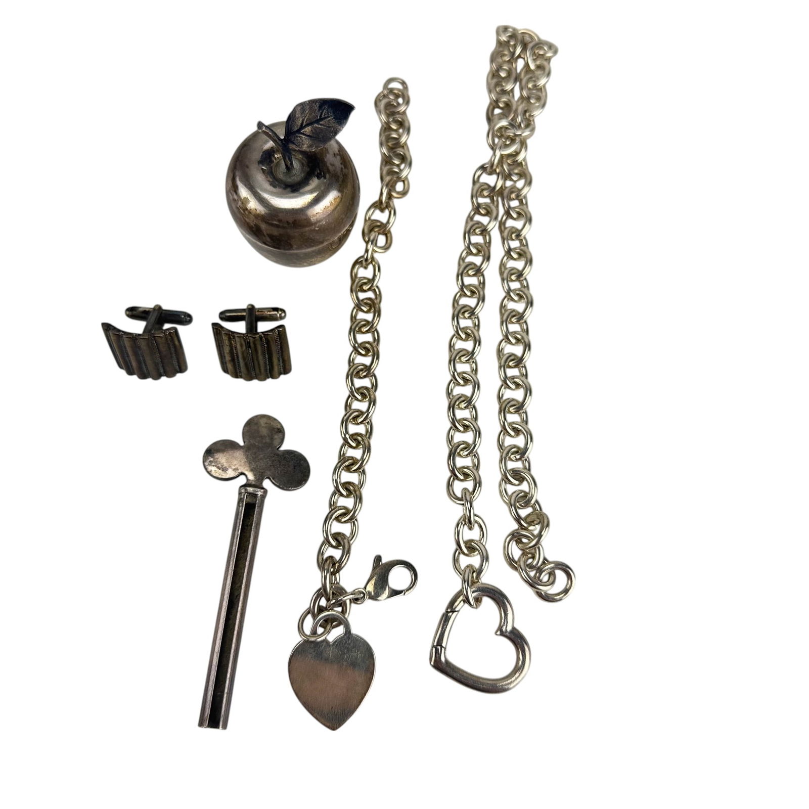 Tiffany Co Sterling Cufflinks Key Bracelet Choker: Estate collection lot of a total of five (5) Tiffany & Company sterling silver 925 collectibles and jewelry. Includes ~ One (1) Pair of shirt cufflinks. One (1) Heart charm link bracelet. One (1) Hear