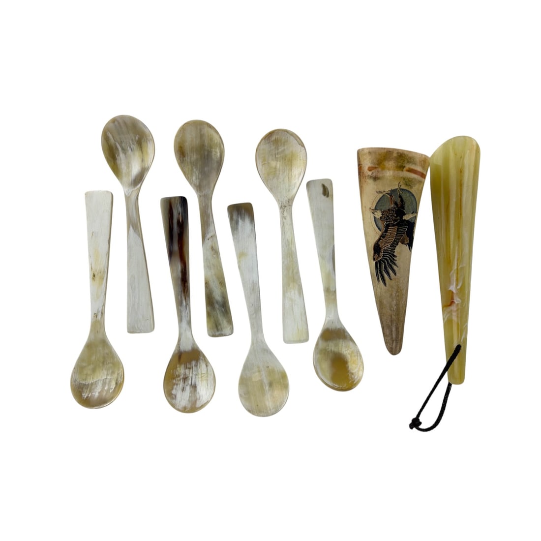 Water Buffalo Horn Tea Spoons & Signed Scrimshaw: Includes a total of seven (7) spoon cutlery utensils, a shoe horn with hanging cord and a polychrome horn cone with an engraved scrimshaw eagle motif. Spoons measure 7 1/4". Shoe horn : 8 1/4". Scrims