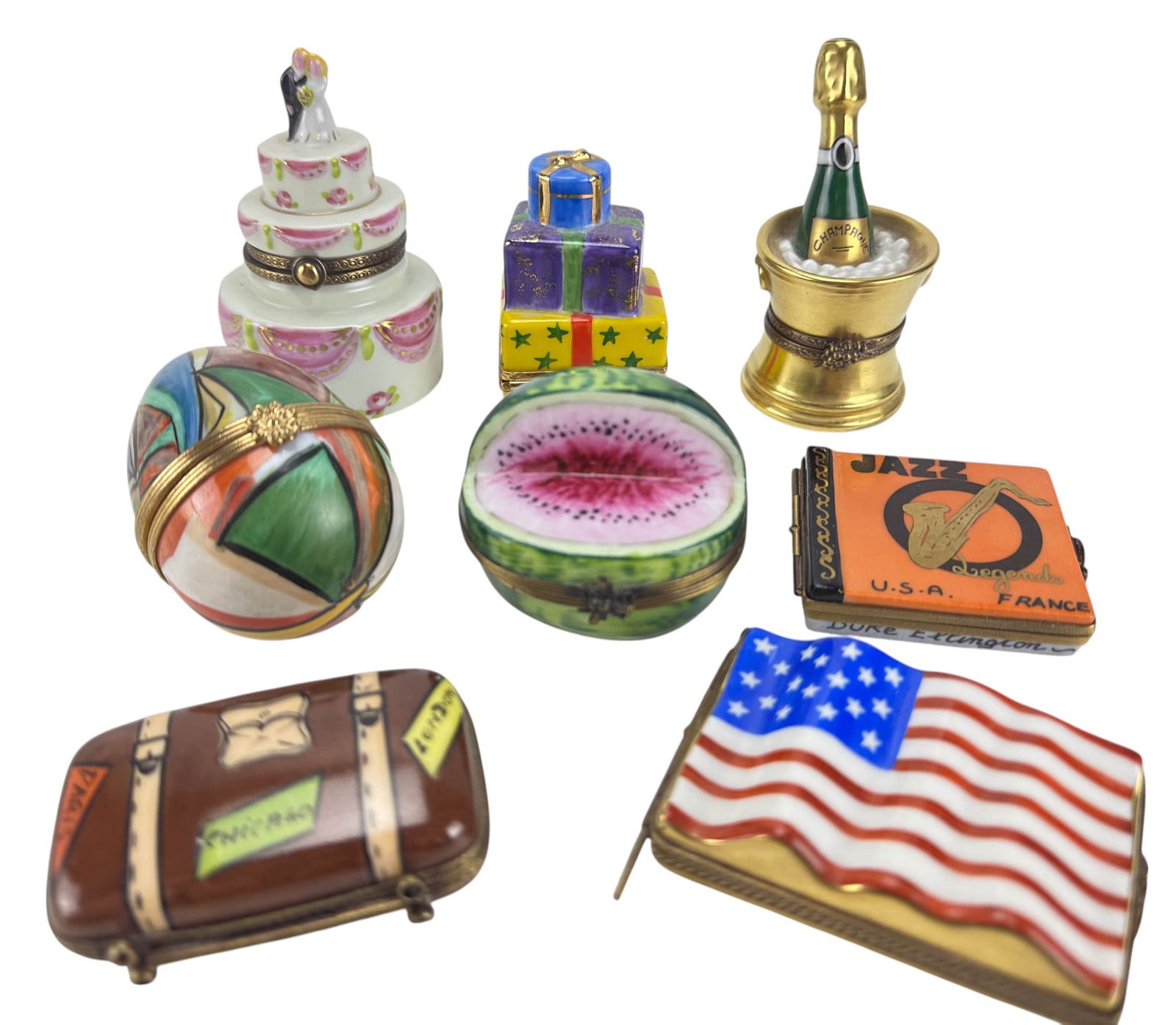 Limoges France Figural Porcelain Trinket Box LOT: Group of eight hand painted porcelain trinket boxes, each signed Limoges France either on the underside or interior. Forms include a wedding cake with bride and groom topper, champagne bottle in ice b