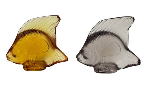 Lalique Crystal Poisson Glass Fish Figurines 2pc: Lalique France, pair of crystal art glass "Poisson" fish figurines, one in a topaz amber coloration, the other in smoky gray coloration. Each molded in a stylized angelfish form with incised detailing