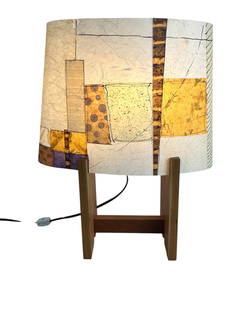 M porter Fiberglass Wood Base Table Lamp SIGNED: M Porter, a signed 2011 table lamp featuring a handcrafted fiberglass shade with a geometric patchwork design in tones of ochre, cream, tan, and violet with abstract spiral and line motifs. The shade