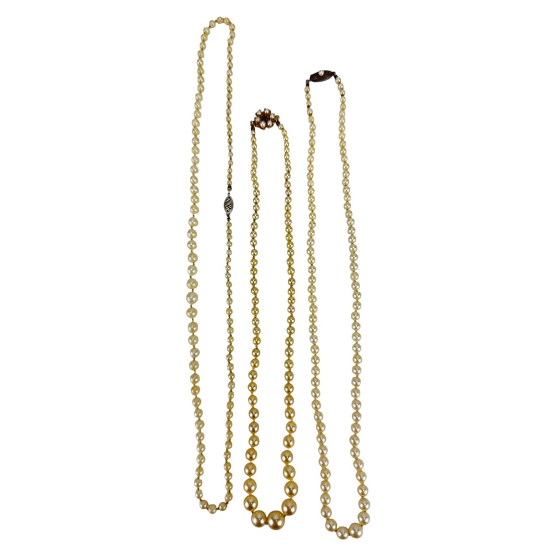 Saltwater Cultured Akoya Pearl Necklace 14K Clasp: Group of three (3) graduated single strand necklaces composed of saltwater cultured Akoya pearls. Each necklace features individually knotted pearls ranging in size with soft cream to ivory luster. Th