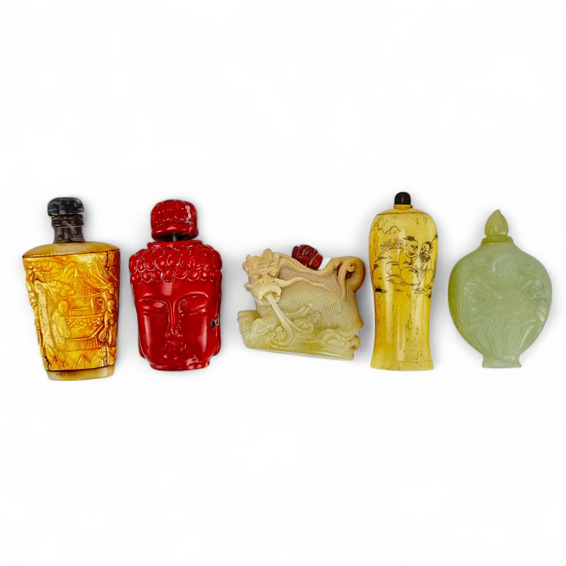 Chinese Red Coral Jade Hardstone Snuff Bottle 5pc: Lot of five Chinese snuff bottles including ~ one (1) High relief carved soapstone bottle with figural motif and dark stopper; one (1) Tall bottle with etched figural scene, likely bovine bone or resi