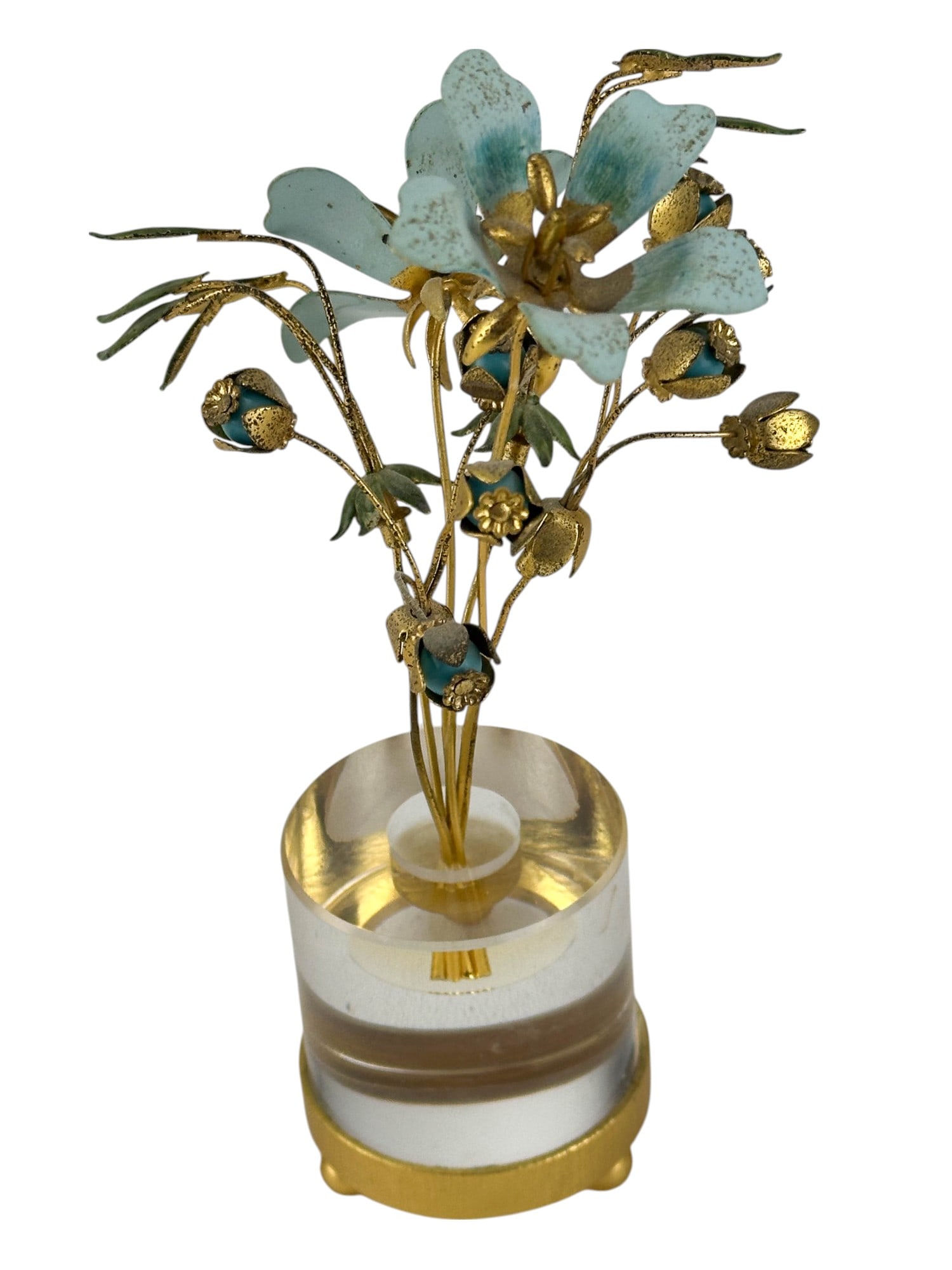 Jane Hutcheson for Gorham Tole Flowers Lucite Base: Jane Hutcheson for Gorham Fleurs Des Siecles botanical arrangement composed of hand painted tole metal flowers with blue petals, gold centers and green foliage. The bouquet is mounted in a clear cylin