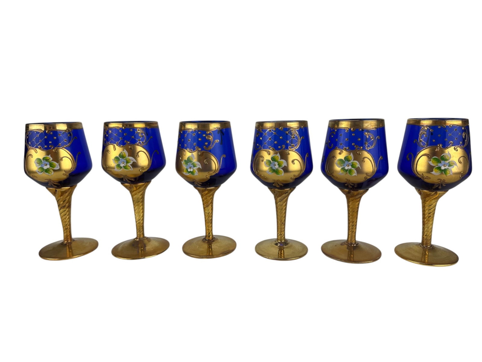 6 Murano Cobalt Glass Enamel Gold Gilt wine Goblet: Murano Italy set of six hand painted cobalt blue and gold gilt barware wine goblets. Each glass features richly decorated 24K gold enamel overlays with raised floral motifs, lattice scrollwork, ribbed