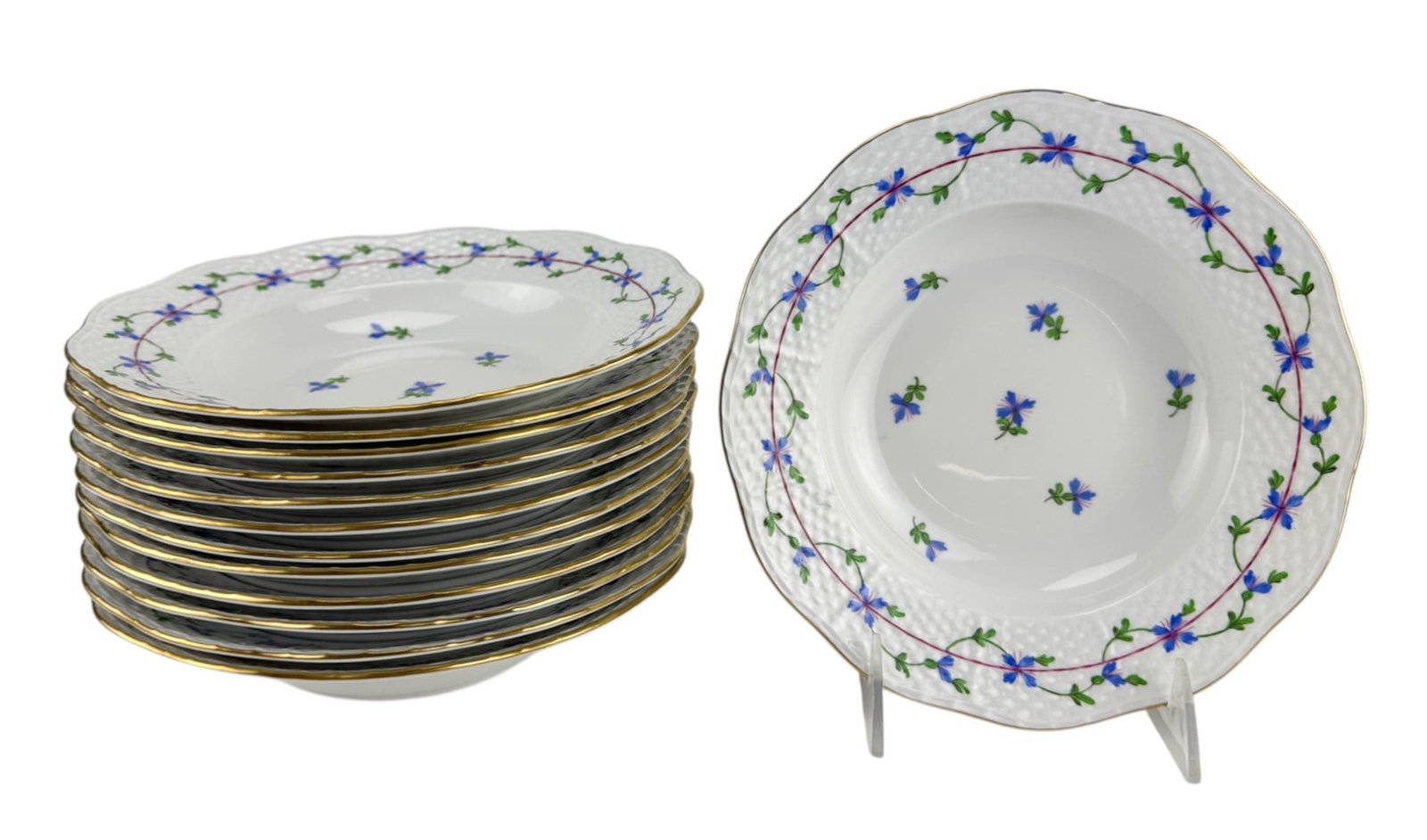 Herend Blue Garland Porcelain Rim Soup Bowls13pc: Herend Hungary Blue Garland circa 1985 porcelain rimmed soup bowls model 504/ PBG 7W, each hand painted with a blue floral decoration, green foliage and gold trim, against a white ground having a glaz