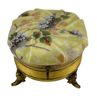 Wavecrest Glass Floral Enamel Vanity Dresser Jar: Late 19th early 20th century Wavecrest glass dresser box with hinged lid and gilt metal ormolu mounts. The opal glass top is decorated with enameled floral designs in lavender and white over a marbled