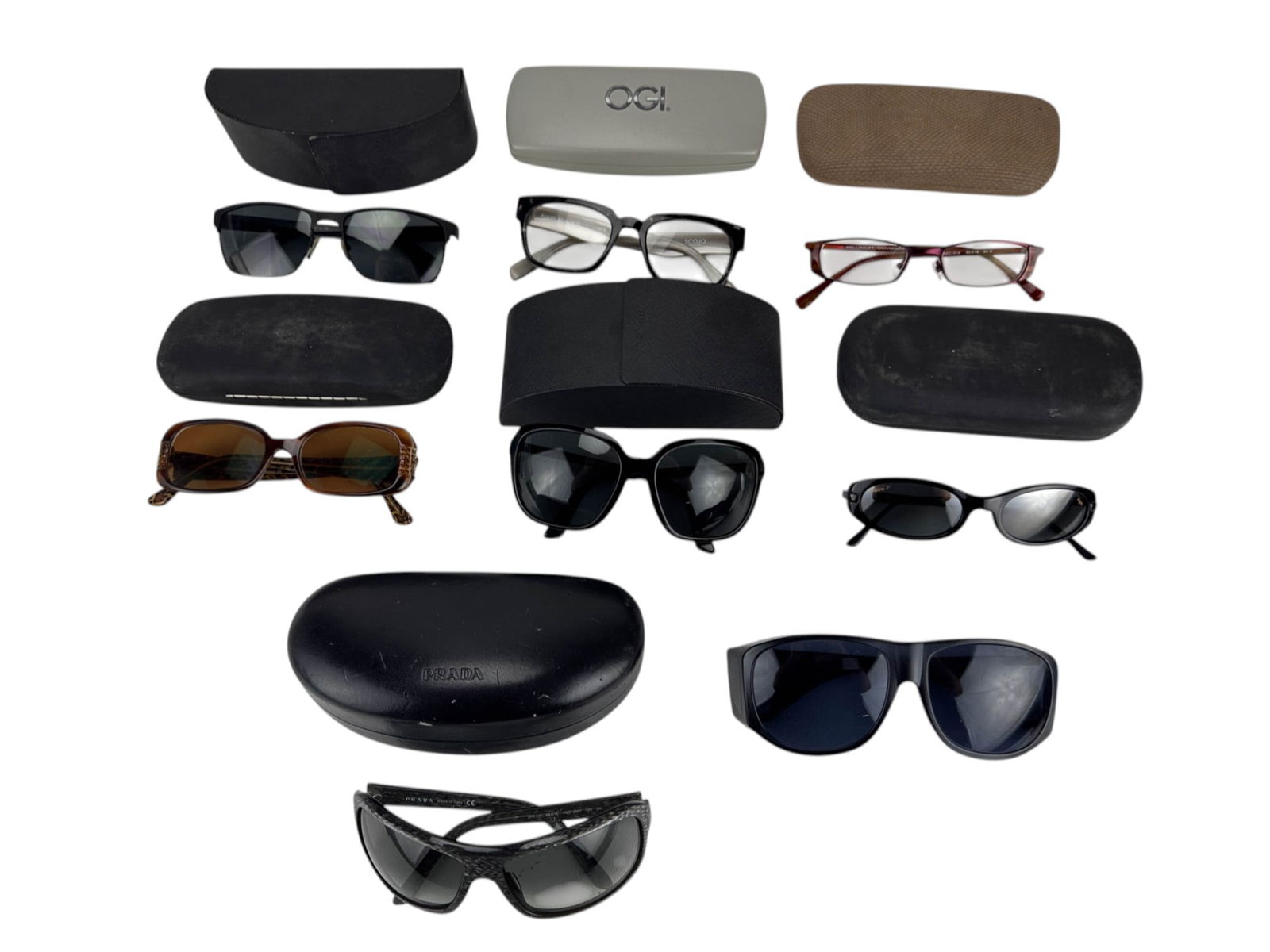 Prada OGI Revo Designer Eyewear Sunglasses 8pc LOT: Prada, Revo, and OGI mixed group of designer eyewear including several pairs of sunglasses and optical frames. Includes two Prada sunglasses with cases, one Revo pair in original case, and an OGI eyeg