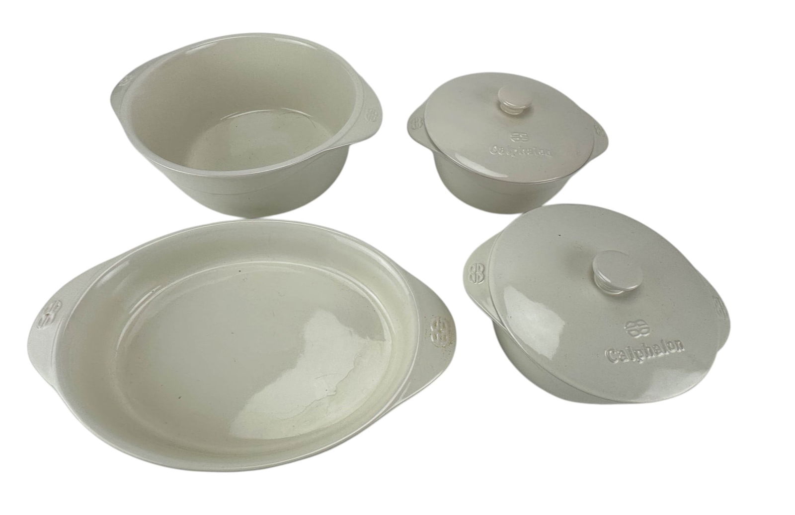 Calphalon White Stoneware Casserole Oval Baker 4pc: Includes a 2 quart oval baker that measures approximately 11" (without the handles) x 8 3/4". The 1.5 quart lidded casseroles measure approximately 5 1/2" (with the lid) x 7 1/4" (not including the ha
