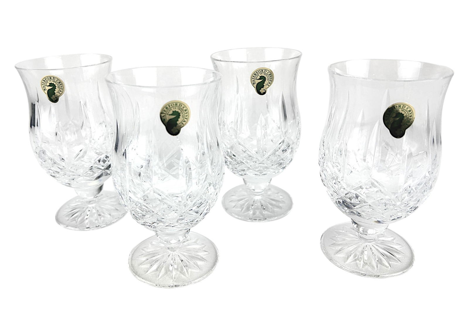 Waterford Irish Crystal Araglin Punch Goblets 4pc: Set of four (4) Waterford Irish cut crystal art glass punch goblets. Pattern Araglin. Production years 1987-2022. Each tulip shaped glass showcases alternating vertical cuts over a diamond quilted des