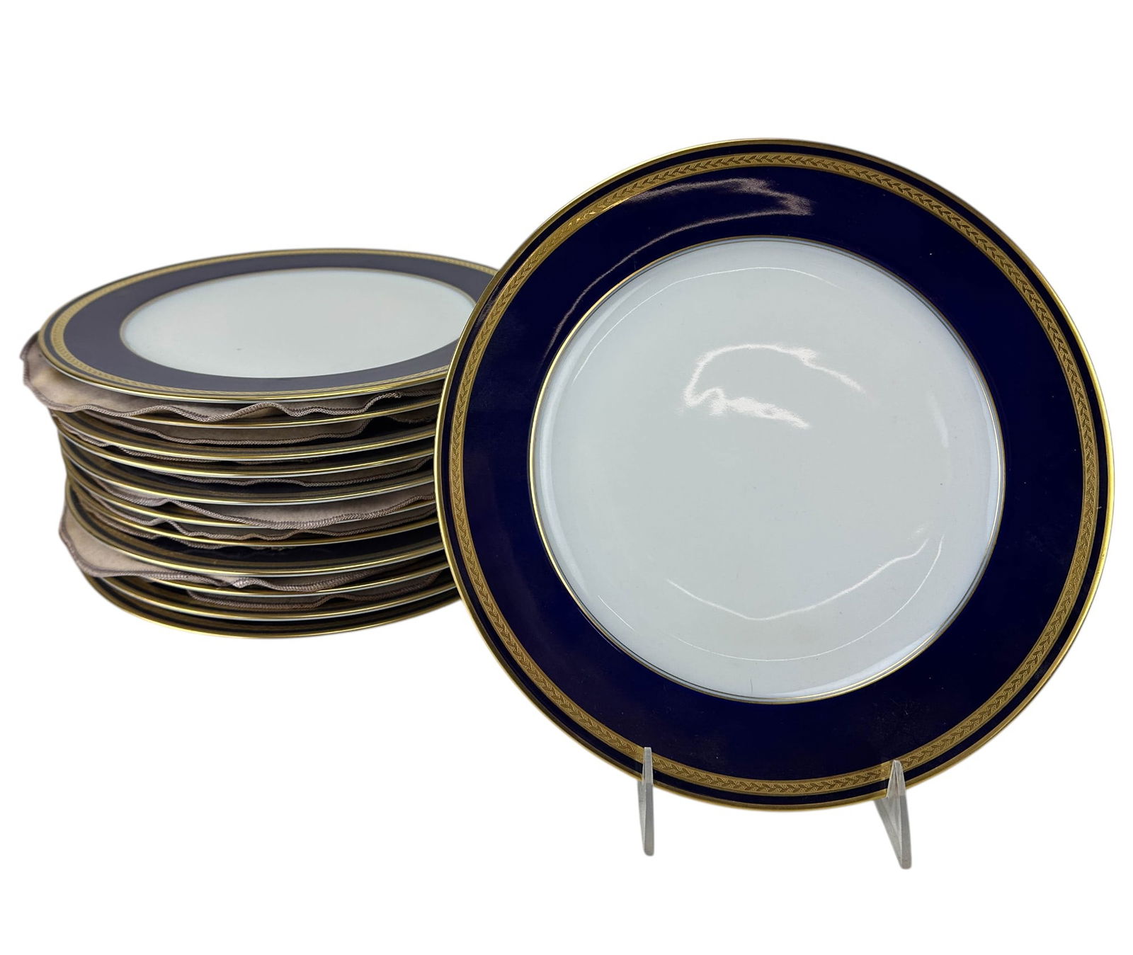 12 Hutschenreuther Porcelain Monarch Dinner Plates: Lorenz Hutschenreuther Germany for Pasco, set of cobalt blue porcelain plates in the Monarch 9033 pattern. Production years 1963 - 1989. Featuring a royal blue deep cobalt rim with a gilt laurel borde