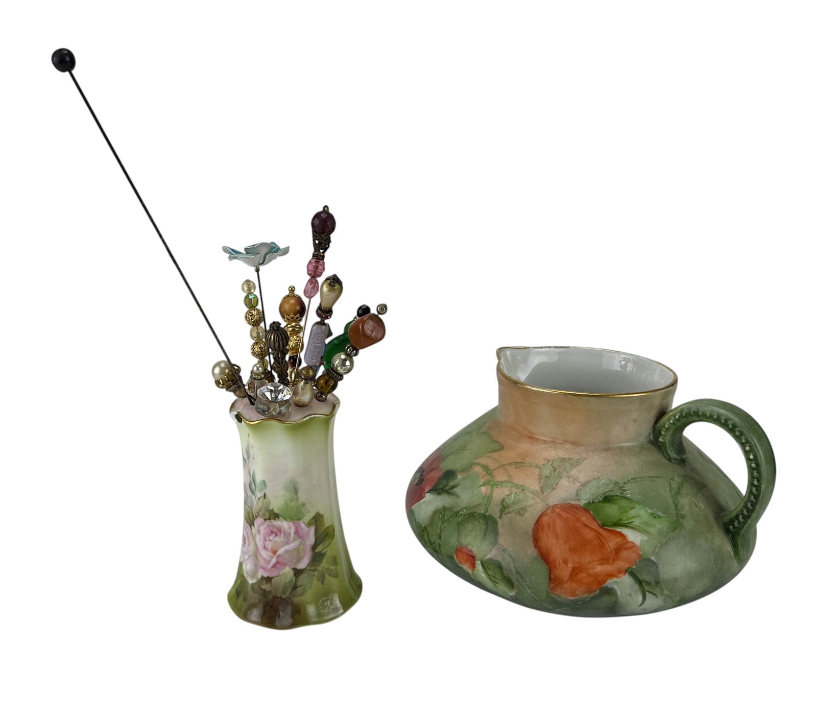 Limoges Pitcher & RS Germany Hatpin Holder w/ Pins: JP Limoges France hand painted porcelain pitcher featuring red, orange and pink poppies amid green foliage, signed P. Bushman to the underside. Accompanied by an RS Germany porcelain hatpin holder, ha