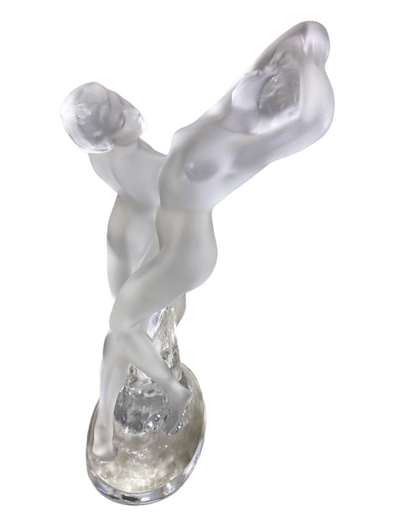 Lalique French Crystal Deux Danseusses Sculpture: Lalique frosted and clear crystal sculpture titled 'Deux Danseusses' depicting two nude modeled dancers in fluid motion. Signed 'Lalique France' in etched script to its base. Dimensions: 10 X 5.25 X 5