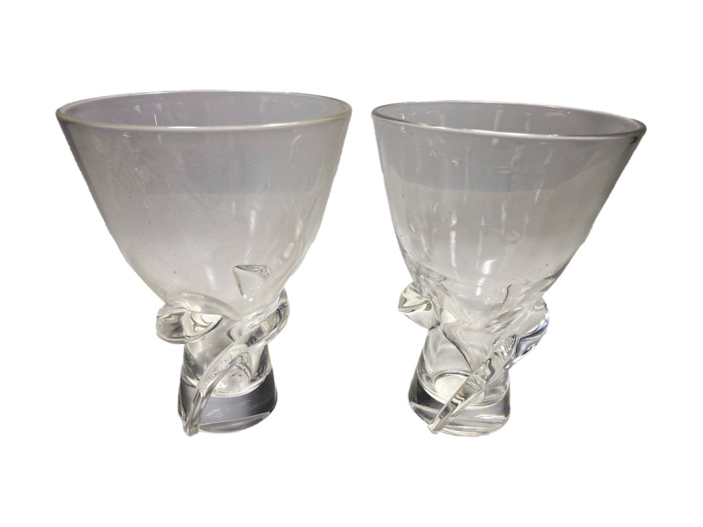 Steuben Crystal Hershey Centennial Vases 2pc LOT: Steuben, pair of matching crystal vases with applied ribbon or leaf wraps at the base and pedestal feet. Script-signed Steuben and mold-marked HERSHEY 1894â€“1994 on the foot rim, commemorating t