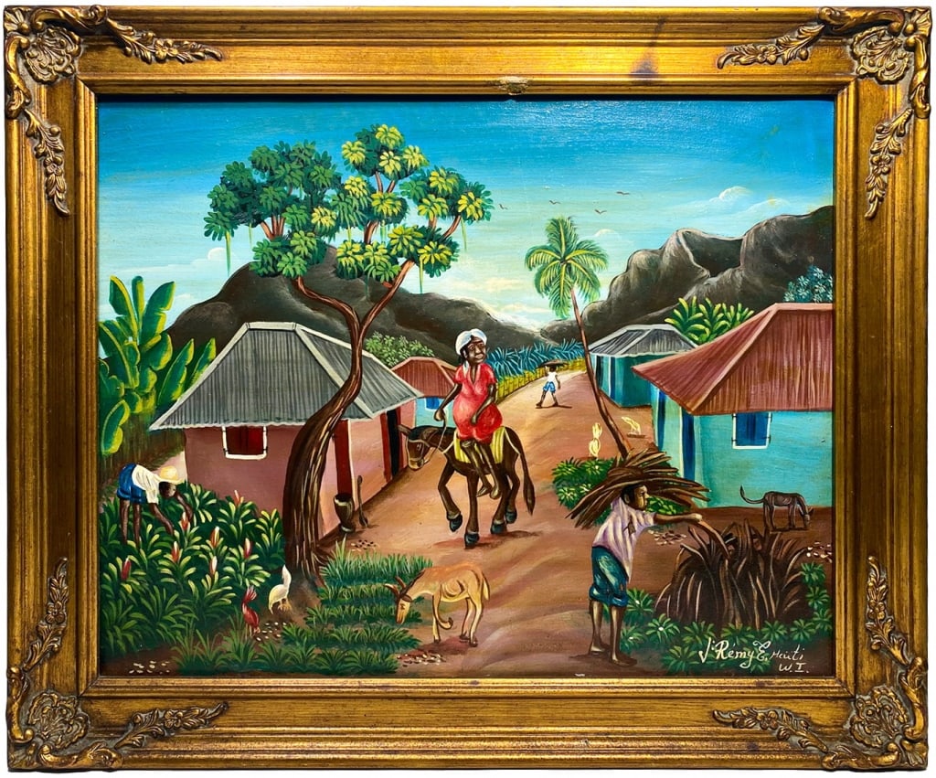 J. Remy E Haitian Village Oil Painting on Canvas: A 20th century Haitian village oil painting on canvas depicting a scene with villagers carrying harvested bundles, riding donkeys, surrounded by tropical houses and livestock. Signed to the lower righ